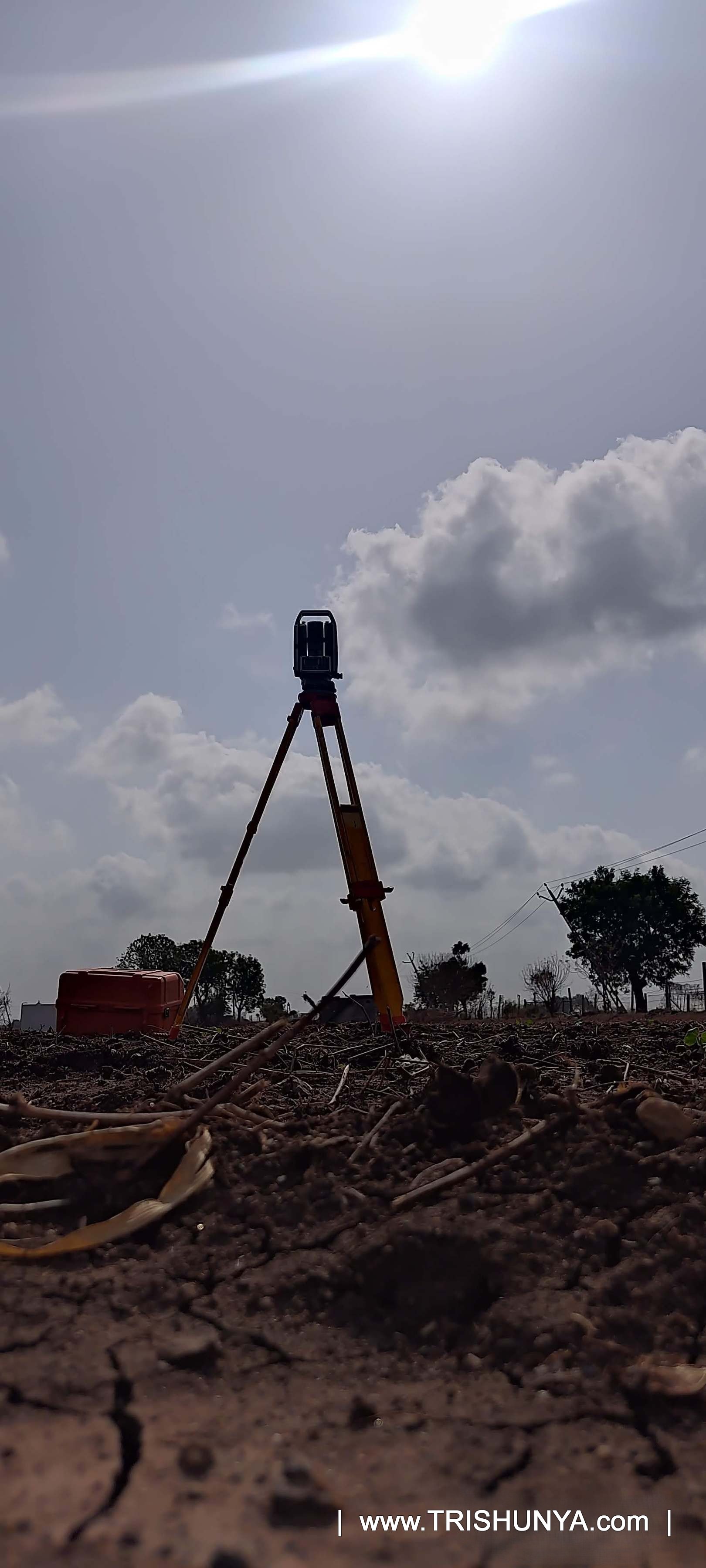 Total Station leveled and set up on farmland ready for survey work