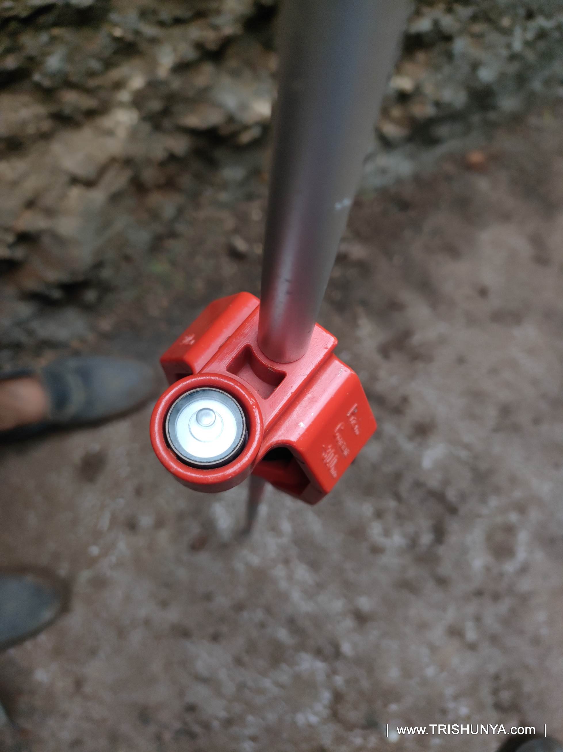 Close up of mini prism bubble level used for accurate prism leveling