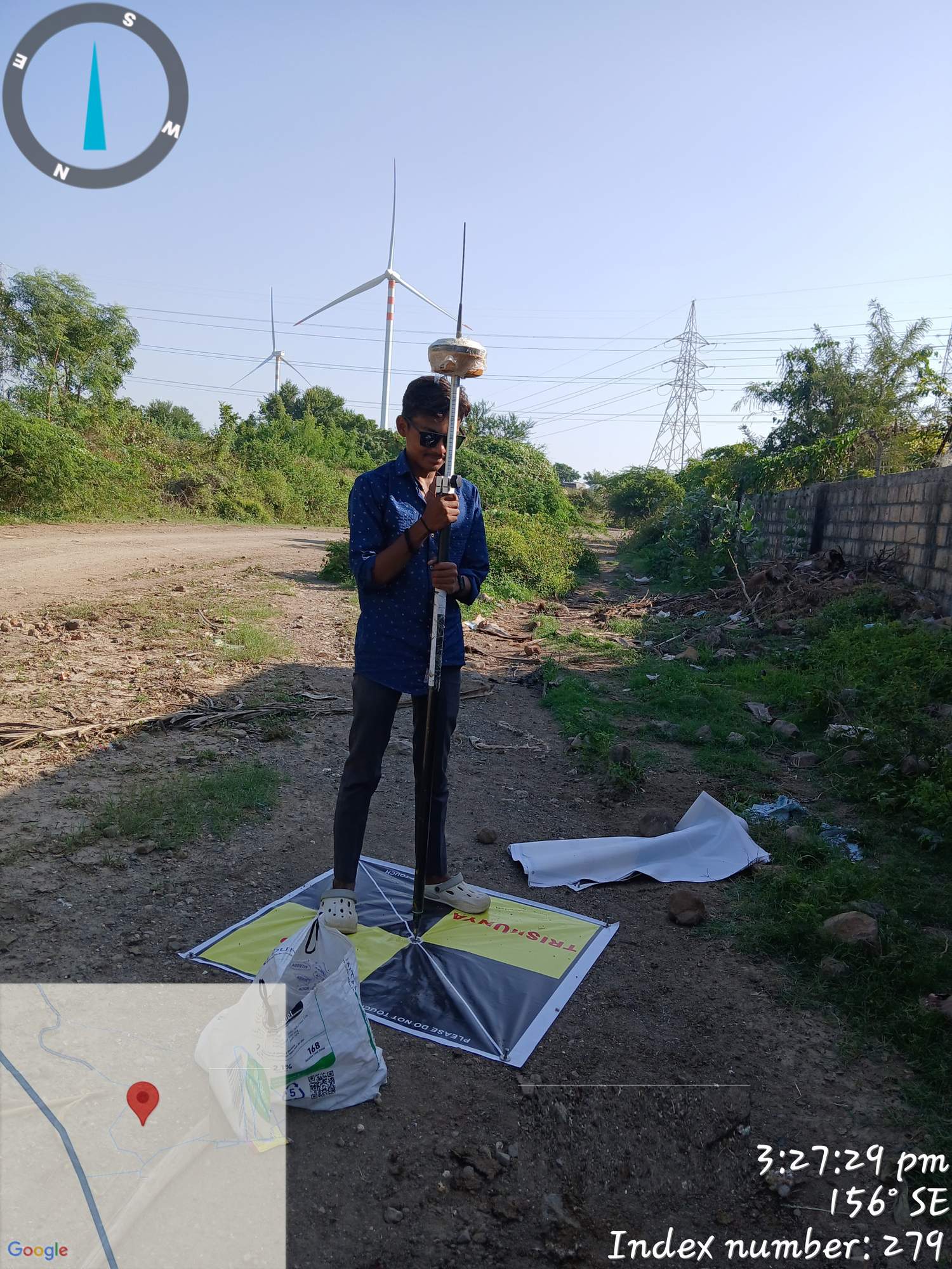 Survey team placing ground control points for drone survey accuracy in infrastructure project